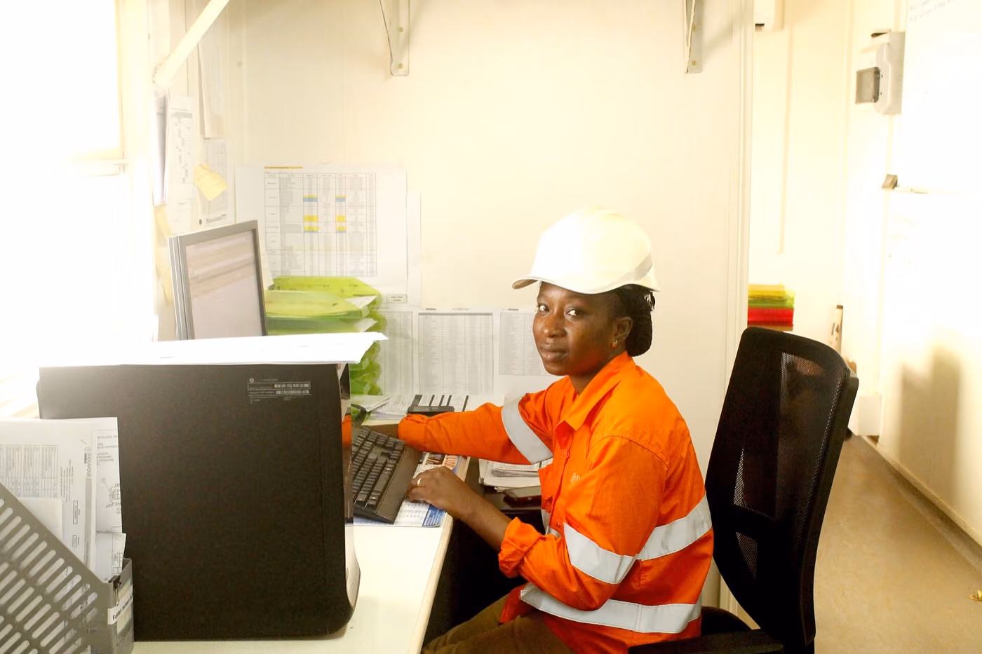 Mining engineer working at a site office workstation